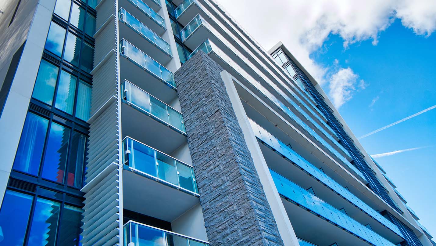 view of condo tower from the ground up